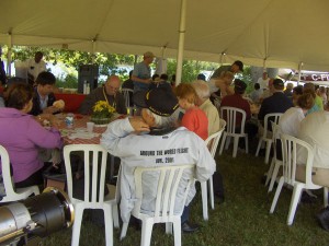 Guests enjoying bbq lunch in tent
