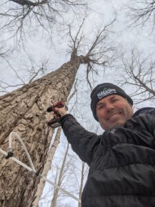 Tom Shaw taps a maple tree