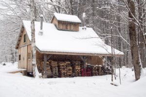 photo of maple shack in snow