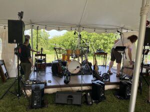 The band is set up in the tent