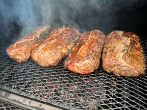 Prime rib roasts on the grill