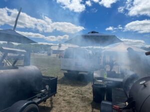 The Shaws Catering grills hard at work creating an inviting aroma and delicious grilled meat