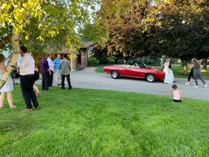 The bride and groom pose with the 1969 GTO