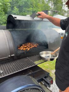 Chicken wings roasting on the grill at the celebration of life in Sutton