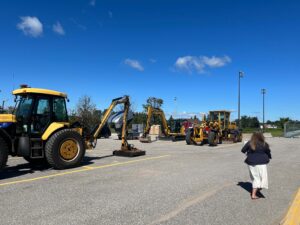 Heavy equipment from the Township of Oro-Medonte is set out in the Community Centre parking lot for staff to see