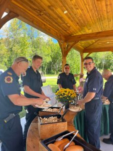 Firemen enjoy the custom buffet at the Rama Daycare End of Summer Event