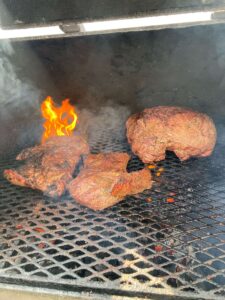 Roast hip of beef on the grill