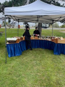 Ainsley and Carley set up the Shaws Catered buffet table