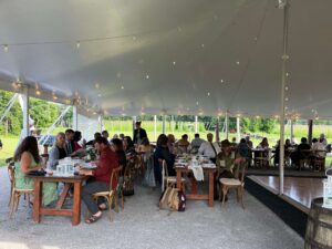 Guests enjoy dinner in the spacious tent