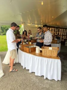 Madalynn and Thomas lead the wedding party through the Shaws Catering bbq buffet