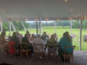 Dinner in the reception tent with the hop fields in the background creates a relaxed, peaceful atmosphere