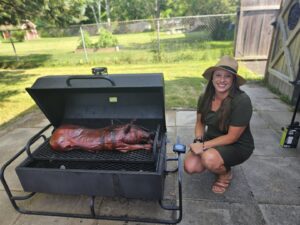 Natalie, co-owner of Themagenix poses with her Shaws DIY pig roast