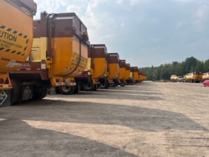 Waste Management trucks lined up at the Miller Waste depot