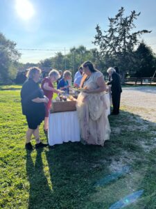 Shari helps the bride as she leads her guests through the Shaws Catering buffet