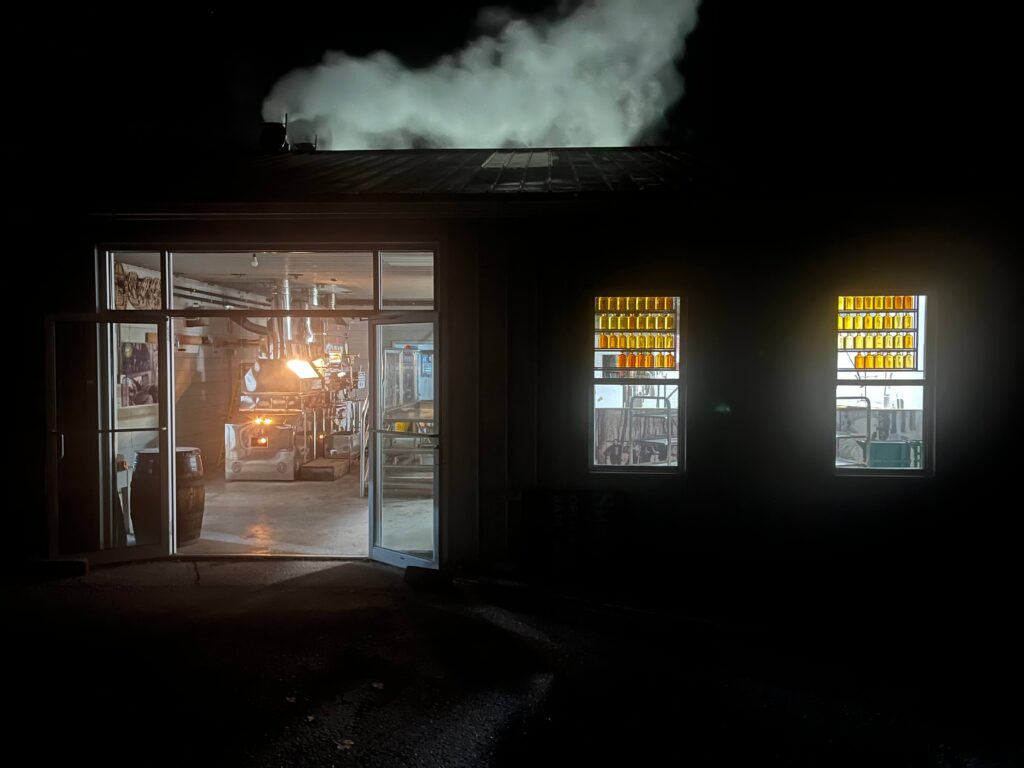 Shaws sugar shack at night as Tom boils the first run of 2024